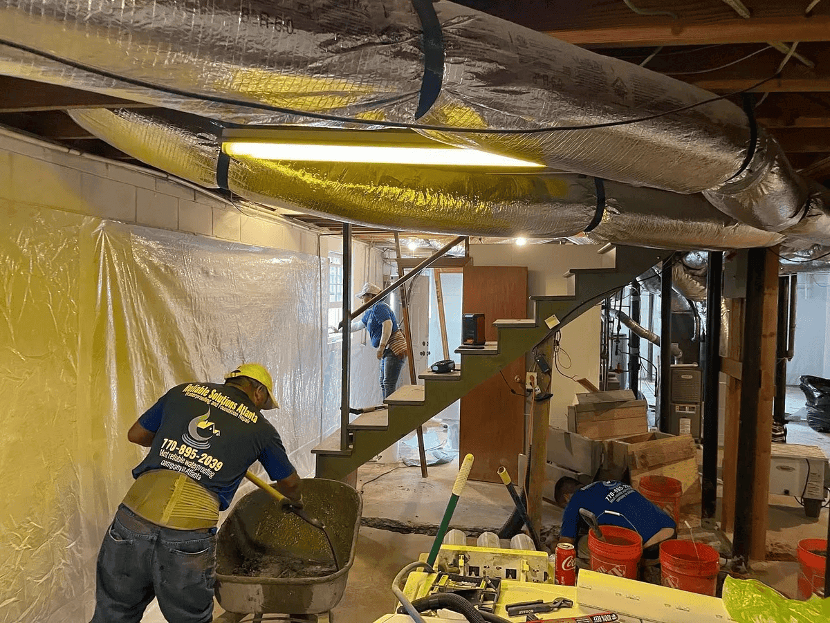 Interior basement waterproofing installation in an Atlanta home