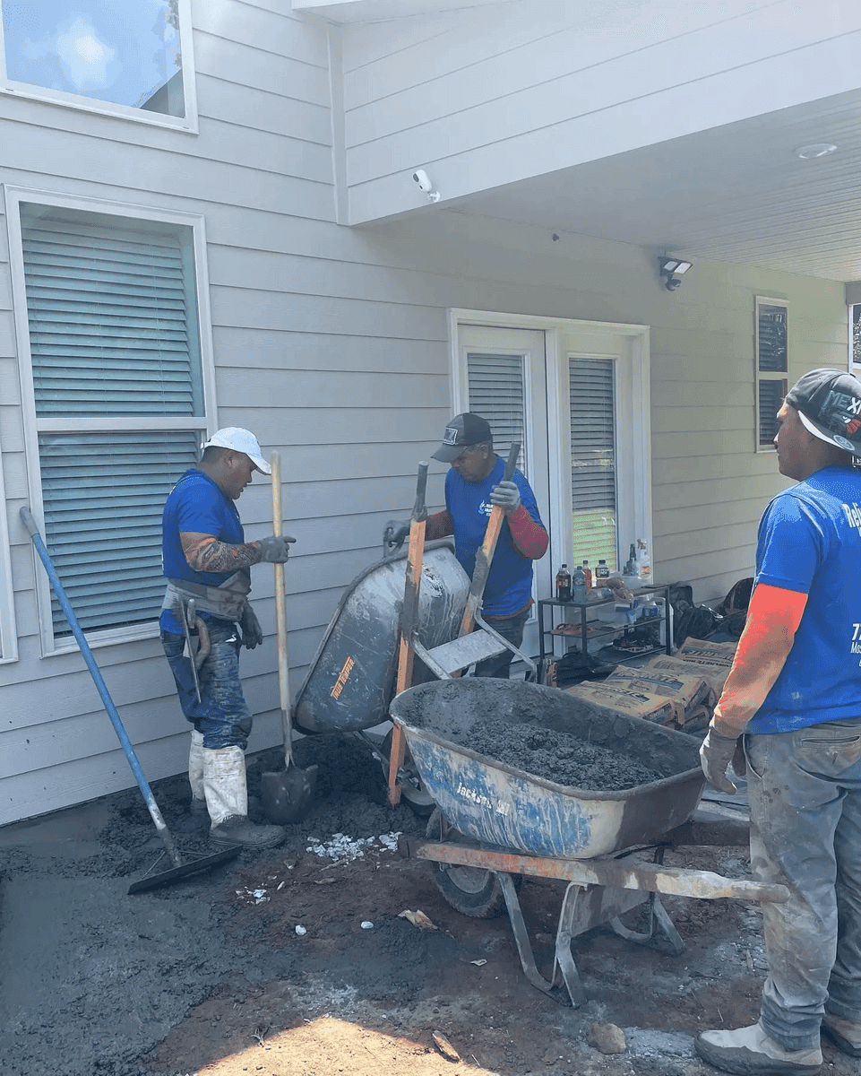 Crew working on concrete patio