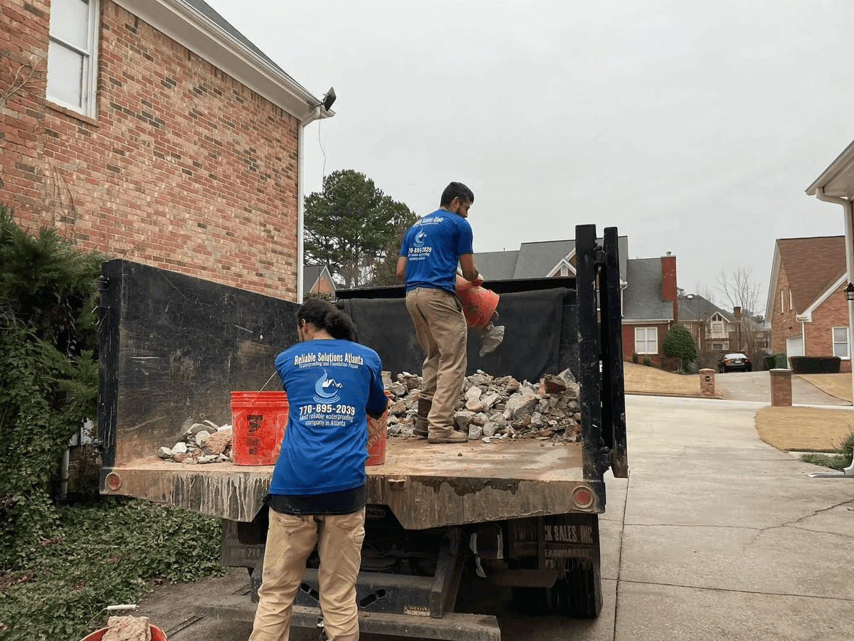 Crew loading debris into truck